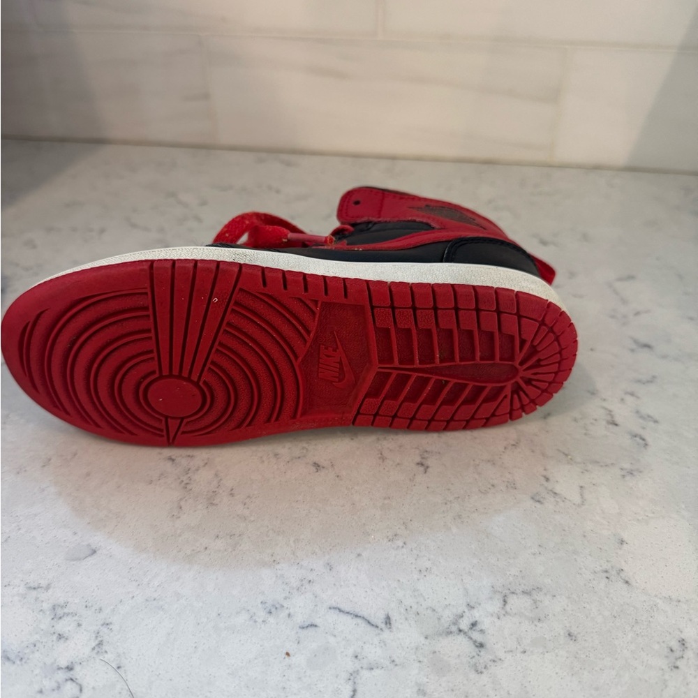 Black and red boys Jordan sneakers